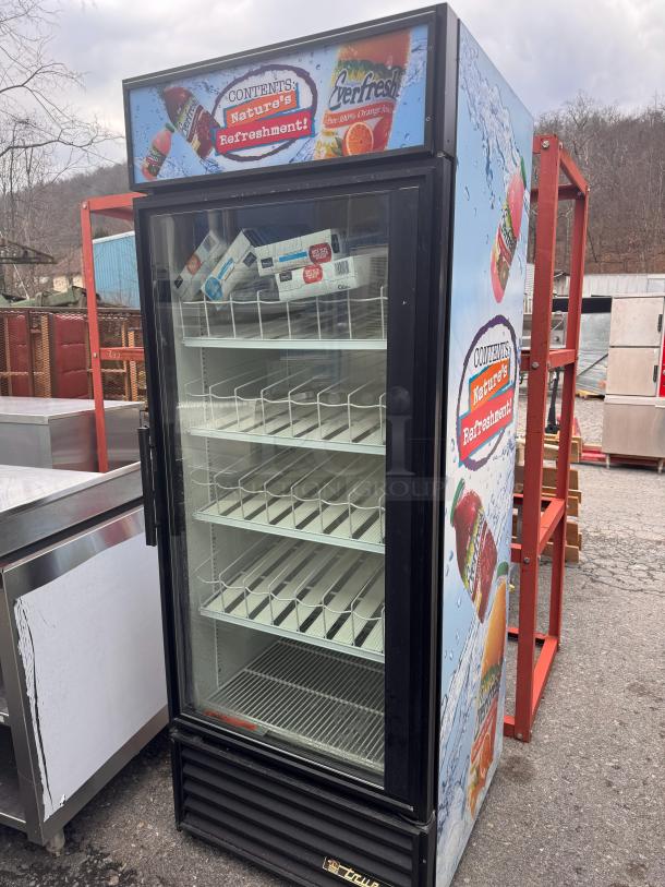 TRUE GDM-26 single glass door refrigerator, tested and working, featuring promotional graphics, black trim, clean interior.