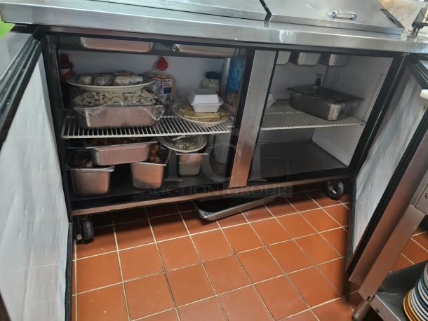 TRUE 60" prep table, stainless steel, dual doors open showing interior shelves, tested and working, used condition.