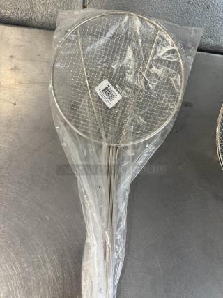 8" round wire skimmer in new condition, stainless steel mesh and handle, partially wrapped in plastic with barcode label.