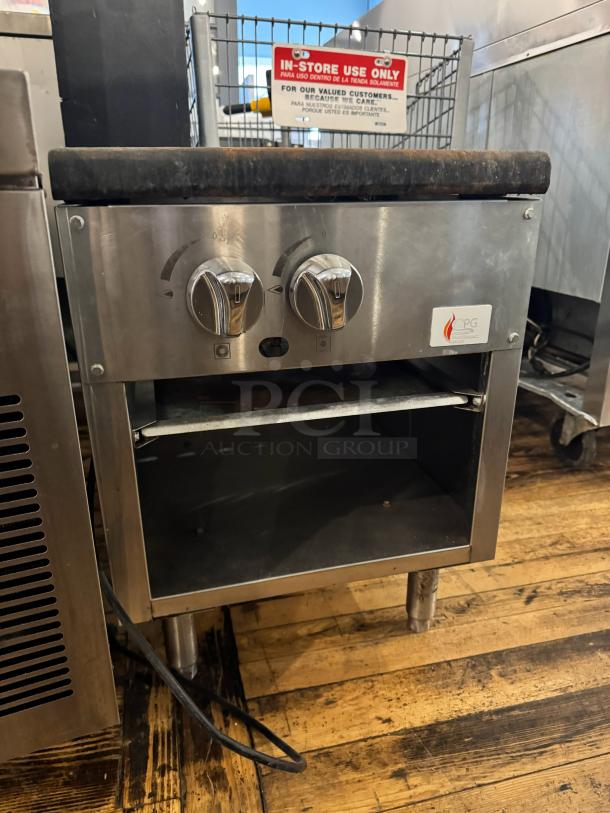 CPG NG Stock pot range, stainless steel, dual knobs, open shelf, visible CPG logo; suitable for commercial use, good condition.