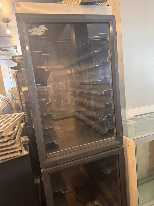 METRO DD8119 holding cabinet, metal shelves, glass door, visible wear on top left, suitable for food service.