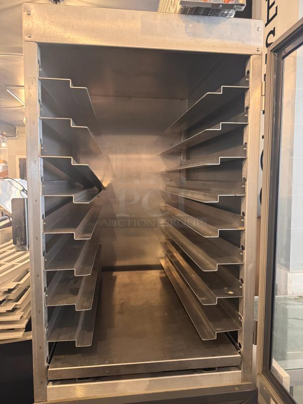 METRO DD8119 holding cabinet with multiple shelves, stainless steel interior, excellent condition.