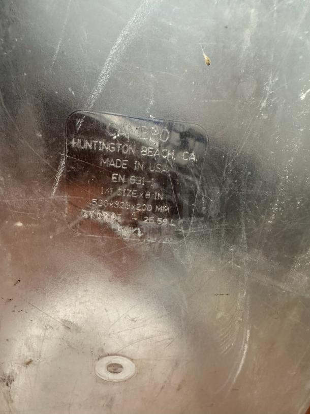 Clear plastic Cambro food storage container, 1/1 size x 8in, 23.05 qt. capacity, made in USA, with visible wear and scuffs.