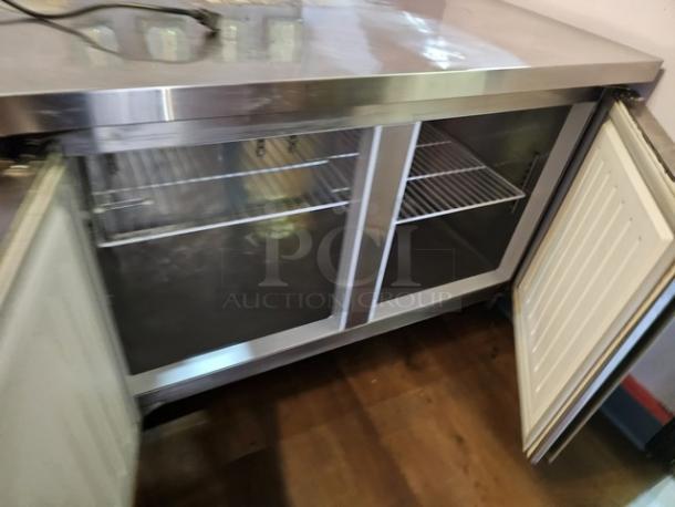 Two-door stainless steel worktop cooler, tested and working, with open doors revealing interior shelving.