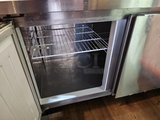 Two-door stainless steel worktop cooler, interior shelving, tested and working, good condition.