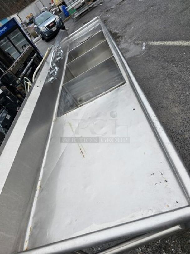 140" stainless steel three-compartment sink with dual drainboards, commercial-grade, sturdy, suitable for high-capacity use.