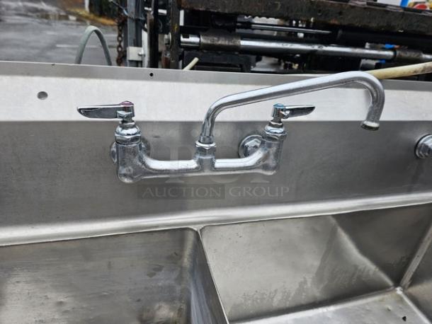 140-inch three compartment stainless steel sink with drainboards, commercial use, faucet included, pre-owned condition.