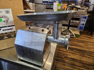 Stainless steel meat grinder model MG-IT-0022-C, 115V, in used condition, with a spacious hopper and visible control knobs.