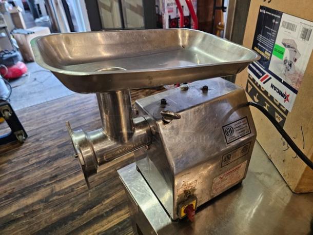 Stainless steel Meat Grinder MG-IT-0022-C, 115V, featuring a large tray and robust build, labeled with electrical specifications.