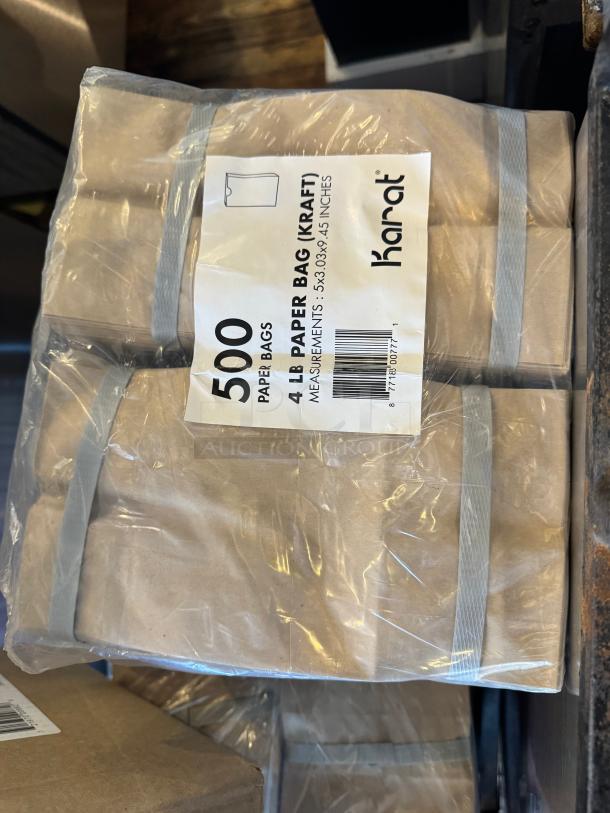 500 Karat kraft paper bags, 4 lb capacity, measurements 5x3.09x9.45 inches, new in plastic wrapping.