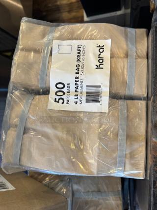 500 Karat kraft paper bags, 4 lb capacity, measurements 5x3.09x9.45 inches, new in plastic wrapping.