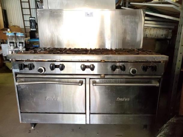 Garland SunFire 60" gas range with 10 burners and two standard ovens. Liquid propane. Stainless steel. Used condition.