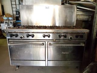 Garland SunFire 60" gas range with 10 burners and two standard ovens. Liquid propane. Stainless steel. Used condition.