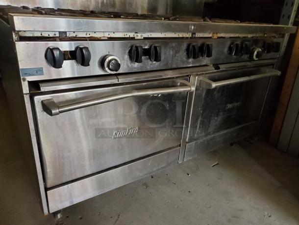 Garland SunFire 10 burner 60" gas range with two ovens, stainless steel, used condition, SunFire logo visible.