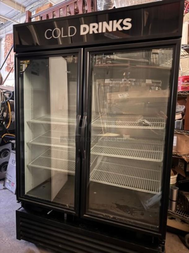 TRUE GDM-49 cooler, two glass doors, tested working, brand label "COLD DRINKS," multiple shelves, used condition.
