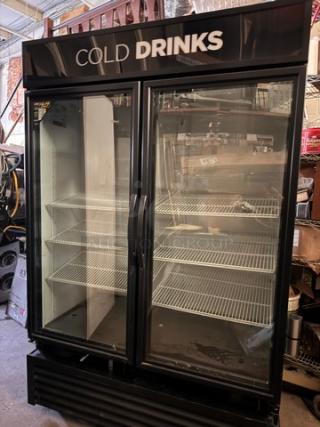 TRUE GDM-49 cooler, two glass doors, tested working, brand label "COLD DRINKS," multiple shelves, used condition.