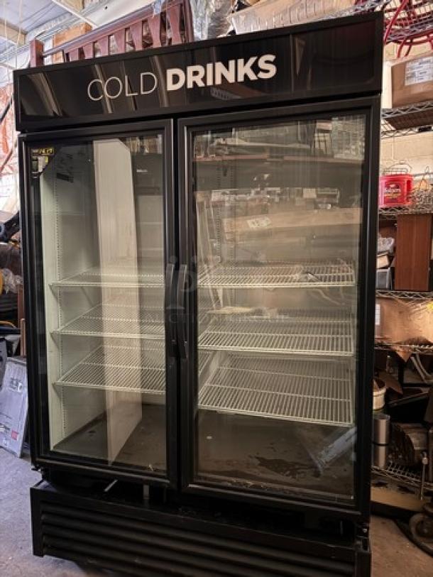 TRUE GDM-49 glass door cooler, two-door model, black, tested and working, spacious shelves, "Cold Drinks" signage.