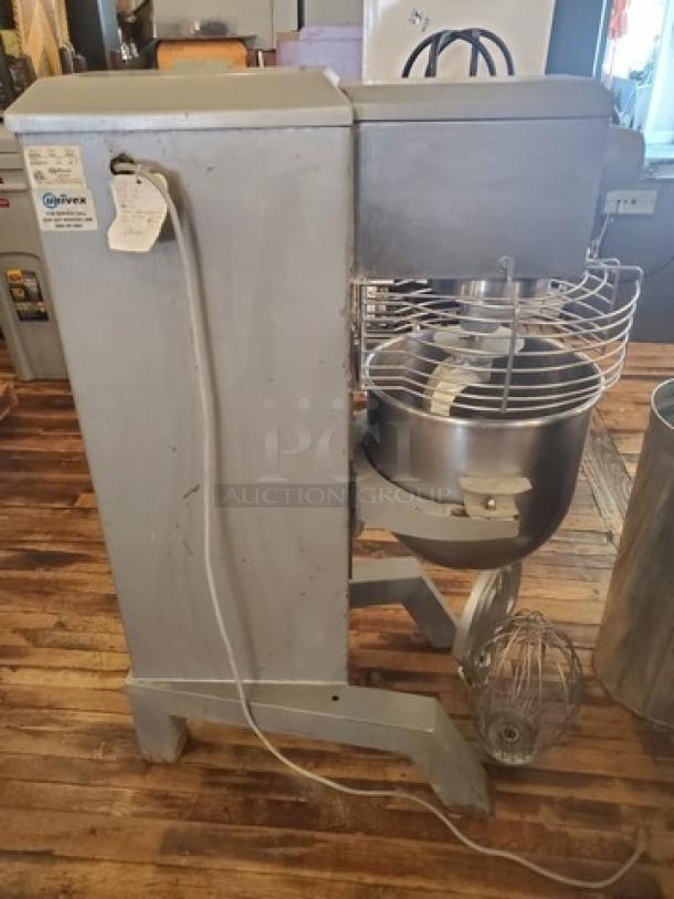Univex SRM30+ 30Qt commercial mixer with attachments; stainless steel bowl, wire guard, and whisk visible; used condition.