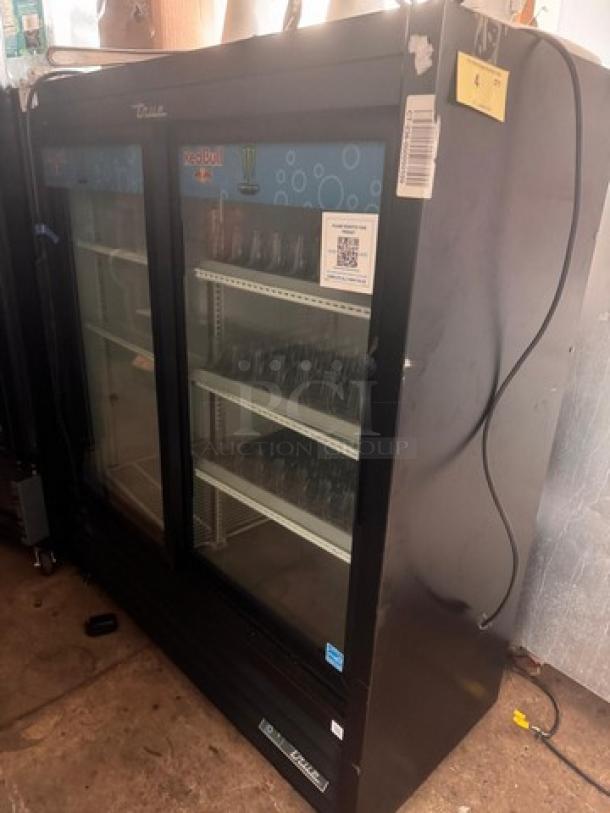 TRUE GDM-41SL two-door cooler merchandiser, good condition, glass doors, adjustable shelves, minor exterior wear.
