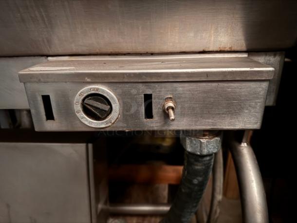 Stainless steel electric kettle control panel, Model TSCE-40, features dial and switch. Securely attached wiring visible.