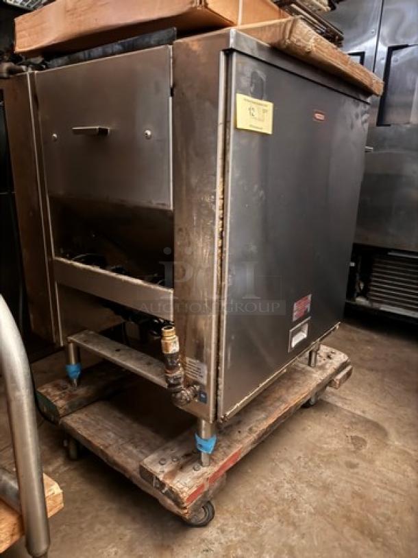 Commercial kitchen equipment with stainless steel exterior, mounted on a wheeled cart. Appears used with visible wear.