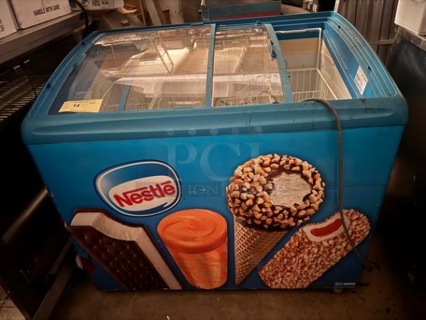 AHT RIO S 100 F ice cream freezer, sliding glass top, Nestlé branding, used condition, vending merchandiser.