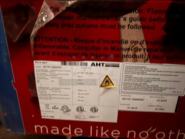 AHT RIO S 100 F ice cream freezer merchandiser, sliding glass top, detailed safety labels, red exterior, model markings visible.