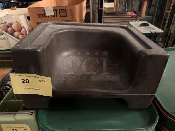 Black booster seat, sturdy plastic, used condition. Visible tag indicates auction quantity: 20.