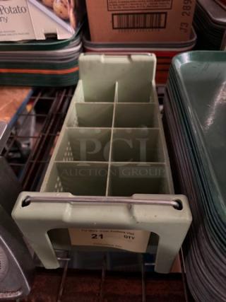 Green flatware rack with eight compartments, in good condition, designed for organizing utensils, sturdy plastic construction.