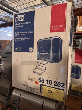 TORK hand towel dispenser in box, Matic model, black, new condition, visible label with item number 55 10 282, Elevation Design.