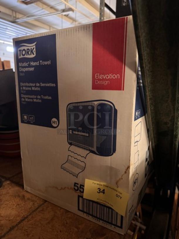 TORK Matic Hand Towel Dispenser box, Elevation Design, H1 system, black. New condition, box shows product image and specifications.