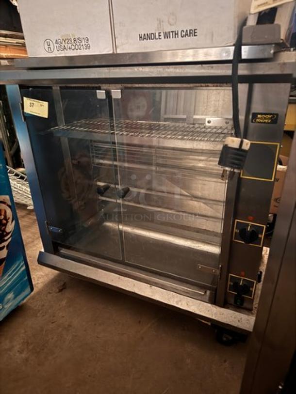 Sodir by EQUIPEX RBE8 commercial rotisserie, 208/240V, stainless steel, dual glass doors, control knobs, excellent condition.