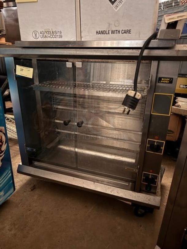 Sodir by EQUIPEX RBE8 Commercial Rotisserie, glass doors, stainless steel, 208/240V, used condition, visible power cord.