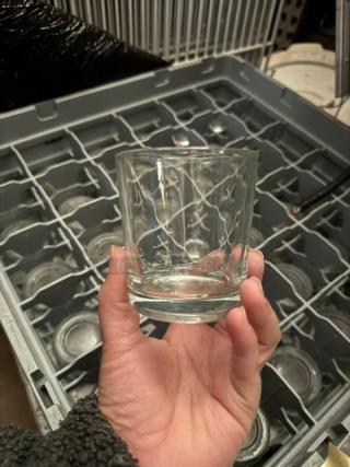 Glass rack filled with matching etched glasses, good condition, all for one price, in dishwasher rack.
