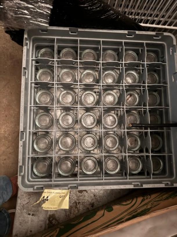 Gray rack with 25 clear glasses, auction lot label "A4." Glasses in good condition, sold as one lot.