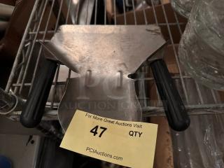 Dual handle French fry scoop, stainless steel, black grips, moderate wear, auction lot tag with number 47 visible.