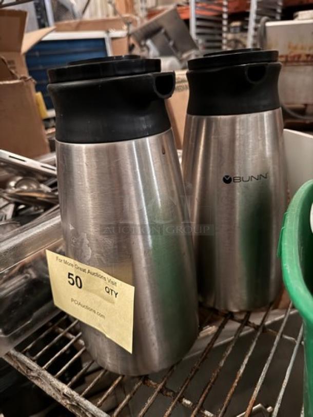 Stainless steel BUNN coffee carafe, model BIDX2, with black lid. Visible wear. Auction quantity note attached.
