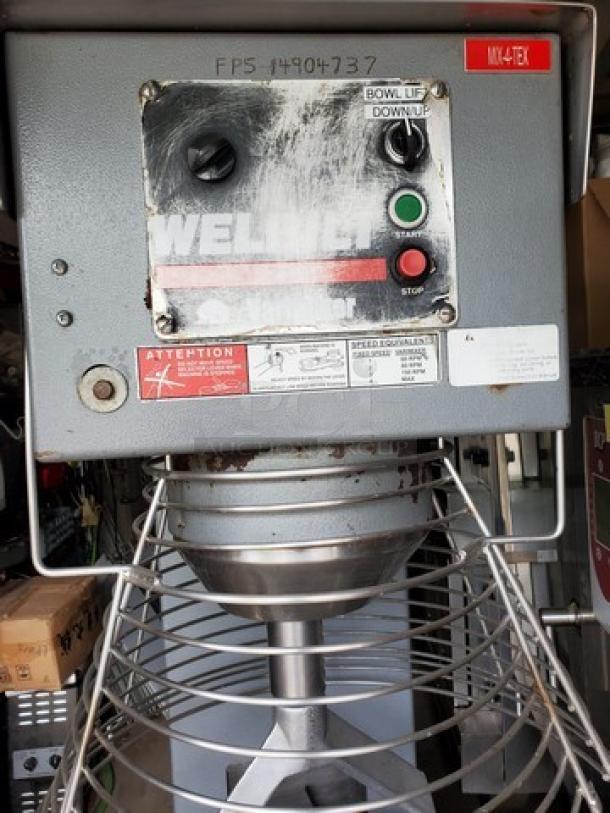 WELBILT W150 Commercial Mixer, Model W150, steel with visible wear, bowl lift controls, safety labels intact, well-used condition.