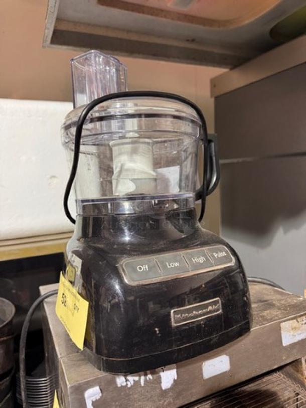 Black KitchenAid food processor with buttons for Off, Low, High, and Pulse. Visible wear indicates used condition.