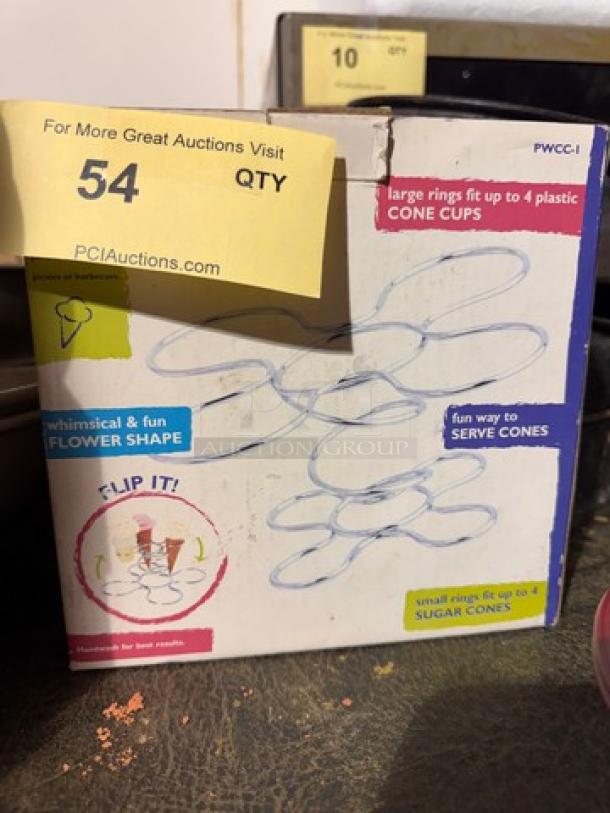 Box of Cone Caddy, whimsical flower shape, fits up to four plastic or sugar cones. Packaging shows fun serving concept.