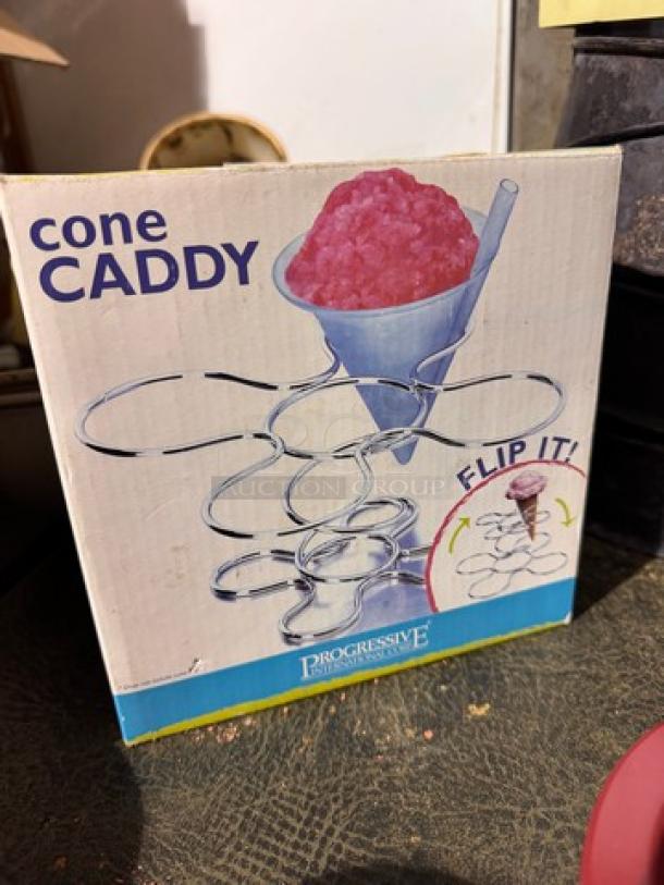 Progressive Cone Caddy box showing metal holder design for serving ice cream cones. Features "Flip It!" illustration.
