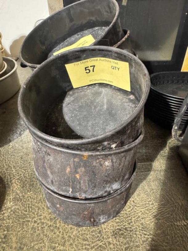 Vintage metal baking pan BIDX3, stackable design, aged condition. Auction tag reads "57 QTY." Ideal for collectors.