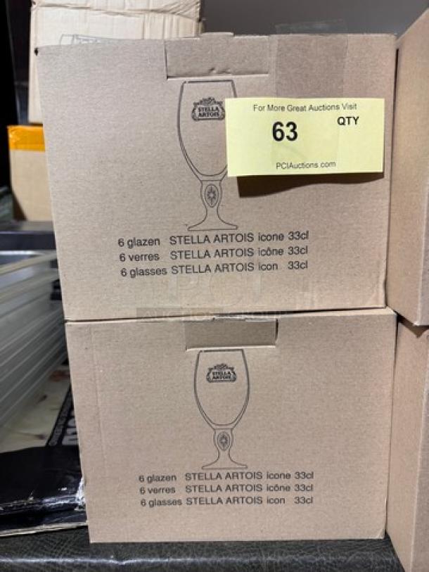 Two boxes of 6 Stella Artois Icone 33cl glasses, new in packaging, totaling 12 glasses. Box labeled in multiple languages.