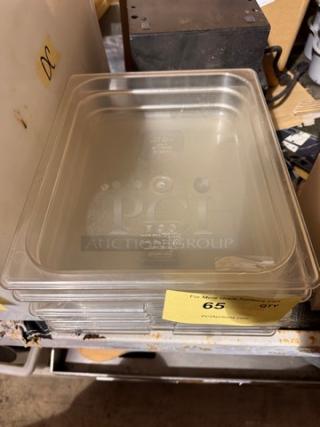 1/2X2.5 IN plastic food pan, model BIDX7, clear, stackable, used, with capacity markings on bottom, lot number 65 visible.
