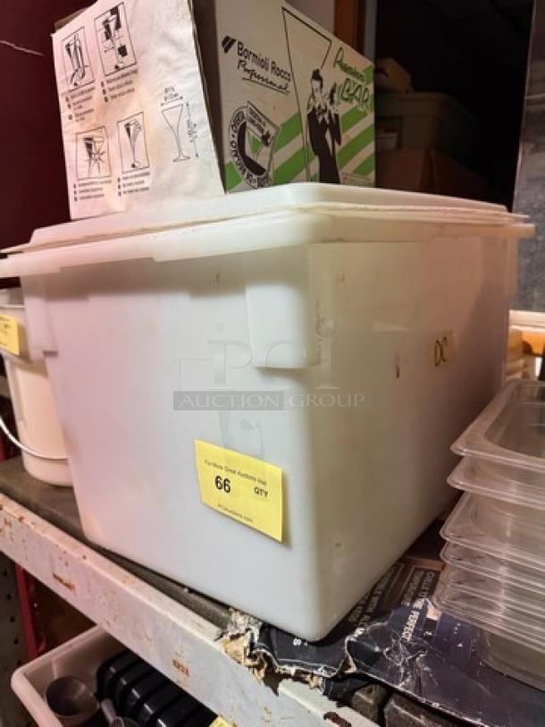 White storage food container with lid, labeled "66 QTY", used condition. Opaque material, suited for bulk storage.