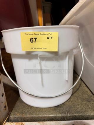 White plastic bucket with a metal handle, in good condition. Label reads "67 QTY" and "PCIAuctions.com".