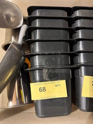 Stack of black 1/6x6IN food pans in good condition. Yellow label shows quantity as 68.