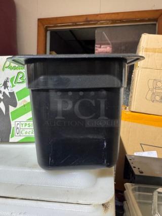 1/6x6IN black food pan, BIDX6 model, durable plastic, good condition, suitable for kitchen use or food storage.