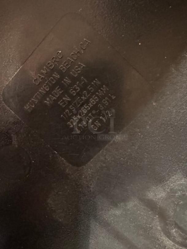 1/2x2.5IN Cambro plastic food pan, black, visible engraving noting size and origin, in good condition.