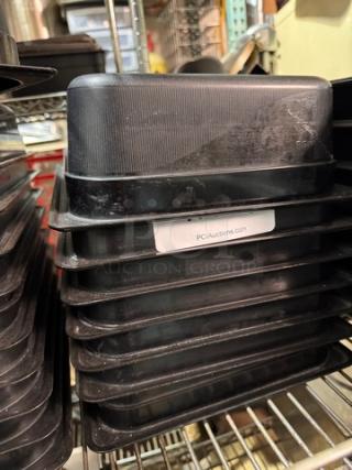 1/2x4IN black food pan BIDX7, stackable, textured surface, label indicates PCIAuctions.com, used condition.